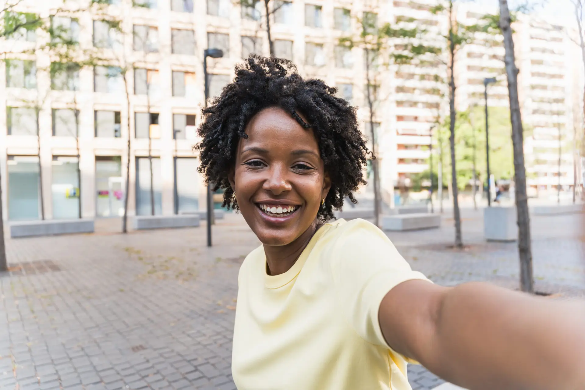 Portrait, selfie smile and happy black woman taking pictures to remember memory, social media or profile picture. Face, beauty and female from South Africa talking photo outdoors